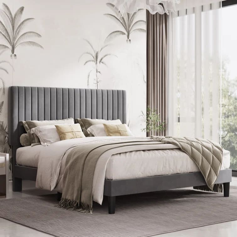 Plush velvet upholstered platform bed with adjustable tufted headboard in a cozy bedroom setting